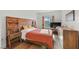 Cozy bedroom with unique wooden bed frame, stylish furniture, and hardwood floors at 30 Strada Di Villaggio # 409, Henderson, NV 89011