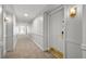 Hallway view of condo number 409 showing doors and carpeted floors at 30 Strada Di Villaggio # 409, Henderson, NV 89011