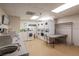 Bright laundry room with multiple washers, dryers and folding table at 30 Strada Di Villaggio # 409, Henderson, NV 89011