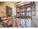 Bright lobby boasts high ceilings, elegant chandelier, and floor-to-ceiling windows with views at 30 Strada Di Villaggio # 409, Henderson, NV 89011