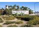 Lake Las Vegas entrance sign amid desert landscaping, showcasing community branding and established flora at 30 Strada Di Villaggio # 409, Henderson, NV 89011