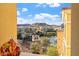 Scenic view of European-style buildings near a lake, framed by the interior of a residence at 30 Strada Di Villaggio # 409, Henderson, NV 89011