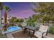 Balcony view with pool view and outdoor seating with patterned cushions at 3024 Half Shell Way, Las Vegas, NV 89128