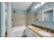 Bathroom featuring a double sink vanity and a shower-tub combo with tile surround at 3024 Half Shell Way, Las Vegas, NV 89128
