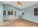 Spacious bedroom boasts a bay window, a door to the balcony, and neutral carpeting at 3024 Half Shell Way, Las Vegas, NV 89128