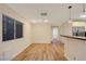 Dining room features hardwood floors, recessed lighting, and a view into the kitchen at 3024 Half Shell Way, Las Vegas, NV 89128