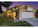 Lovely two-story home with decorative columns, large windows, and a manicured green lawn at 3024 Half Shell Way, Las Vegas, NV 89128