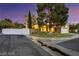 Picturesque two-story home on a corner lot with a well-maintained lawn and desert landscaping at 3024 Half Shell Way, Las Vegas, NV 89128