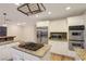 Kitchen with stainless steel appliances, double oven, granite countertops, and a center island with built in cooktop at 3024 Half Shell Way, Las Vegas, NV 89128