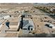 An aerial view shows this single story home with driveway surrounded by desert landscape at 311 S Lisbon St, Henderson, NV 89015