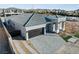 Elevated view showing the roof and driveway of this modern single story home at 311 S Lisbon St, Henderson, NV 89015