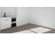 Wet bar area with beverage cooler, modern cabinetry, and sleek countertop at 311 S Lisbon St, Henderson, NV 89015