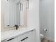 Modern bathroom with floating vanity, marble countertop, and stylish lighting at 311 S Lisbon St, Henderson, NV 89015