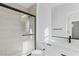 Modern bathroom with glass-enclosed shower and sleek vanity at 311 S Lisbon St, Henderson, NV 89015