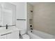 Bright bathroom featuring a tub and shower combination and a modern vanity at 311 S Lisbon St, Henderson, NV 89015