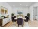 Elegant dining room with a white table, velvet chairs, and modern decor at 311 S Lisbon St, Henderson, NV 89015