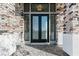 Elegant double front door framed by stone accents and sidelights at 311 S Lisbon St, Henderson, NV 89015