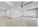 Large garage features epoxy flooring, high ceilings, and ample storage space at 311 S Lisbon St, Henderson, NV 89015