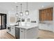 Modern kitchen with a center island and stainless steel appliances at 311 S Lisbon St, Henderson, NV 89015
