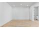 Bright living room features light wood floors, recessed lighting, and ample space for furniture arrangement at 311 S Lisbon St, Henderson, NV 89015