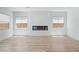 Cozy living room with a modern fireplace and large windows at 311 S Lisbon St, Henderson, NV 89015
