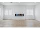 Bright living room featuring wood floors, modern fireplace, and abundant natural light at 311 S Lisbon St, Henderson, NV 89015