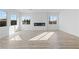 Living room boasting wood flooring, a modern fireplace, and bright natural light at 311 S Lisbon St, Henderson, NV 89015