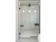 Bright, glass shower with a built-in bench and tiled walls at 311 S Lisbon St, Henderson, NV 89015