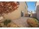 A cozy backyard features a brick patio, stucco wall, and access to the home through sliding glass doors at 3158 Teaderman Walk, Henderson, NV 89044