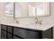 Close-up of the bathroom vanity with double sinks and a stone countertop, complemented by modern fixtures at 3158 Teaderman Walk, Henderson, NV 89044