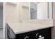Bathroom vanity with a white countertop, dark cabinets, and silver hardware at 3158 Teaderman Walk, Henderson, NV 89044