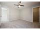 Bright, open carpeted bedroom provides a neutral color palette and access to additional closets and rooms at 3158 Teaderman Walk, Henderson, NV 89044