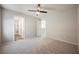 Bright bedroom with three doorways showing access to a bathroom, entryway, and closet; neutral tones and plush carpets at 3158 Teaderman Walk, Henderson, NV 89044
