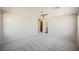 Large bedroom with neutral tones, plush carpeting, a ceiling fan, and easy access to the hallway at 3158 Teaderman Walk, Henderson, NV 89044