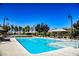 Sparkling community pool with clear blue water and plenty of lounge seating at 3158 Teaderman Walk, Henderson, NV 89044