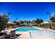 Large community pool with sunshades and clear blue skies at 3158 Teaderman Walk, Henderson, NV 89044