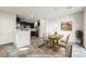 Virtual staging showing dining area and kitchen featuring stainless steel appliances at 3158 Teaderman Walk, Henderson, NV 89044