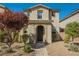Front view of the house with manicured landscaping and a charming entrance at 3158 Teaderman Walk, Henderson, NV 89044