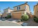 Two-story home with attached two-car garage and low-maintenance desert landscaping at 3158 Teaderman Walk, Henderson, NV 89044