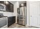 Modern kitchen with stainless steel refrigerator and adjacent door at 3158 Teaderman Walk, Henderson, NV 89044