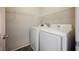 Modern laundry room with washer and dryer at 3158 Teaderman Walk, Henderson, NV 89044