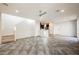 Large, open living space with stairs and access to kitchen and outdoor patio at 3158 Teaderman Walk, Henderson, NV 89044