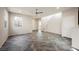 Spacious open-concept living area with tile floors, natural light, and staircase access at 3158 Teaderman Walk, Henderson, NV 89044