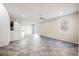 Spacious living room with tile floors, a ceiling fan, and natural light from a window and sliding glass door at 3158 Teaderman Walk, Henderson, NV 89044