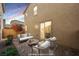 Relaxing patio space with cozy seating and brick pavers perfect for outdoor living at 3158 Teaderman Walk, Henderson, NV 89044
