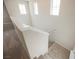 Carpeted staircase with white walls and handrail at 3158 Teaderman Walk, Henderson, NV 89044