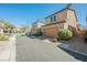 A street view of the home showing garage and desert landscaping at 3158 Teaderman Walk, Henderson, NV 89044