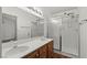 Bright bathroom featuring a dual sink vanity with a shower and tub combo at 3643 Spring Willow Ct, Las Vegas, NV 89147