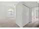 Bright bedroom features vaulted ceilings, large window, and closet with paneled doors at 3643 Spring Willow Ct, Las Vegas, NV 89147