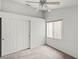 Cozy bedroom with a ceiling fan, large closet, and window providing natural light at 3643 Spring Willow Ct, Las Vegas, NV 89147